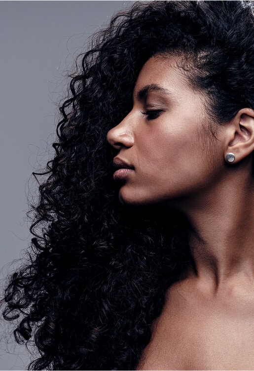side profile of african american woman with thick, curly hair